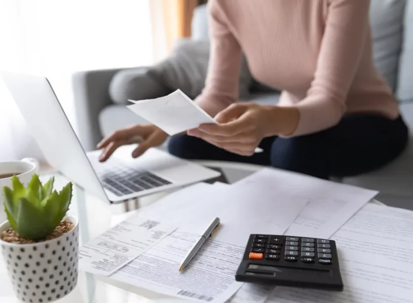 woman-work-on-laptop-at-home-pay-bills-taxes (1)